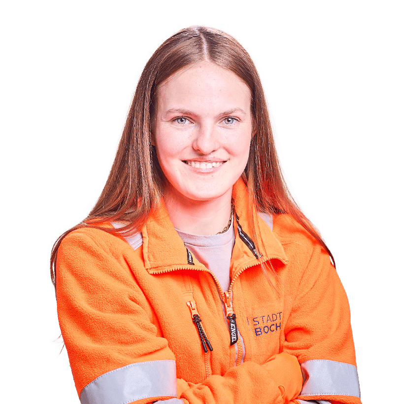 Junge dunkelblonde Frau mit einer orangen Jacke von der Stadt Bochum.